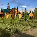 Miles Behind Log Cabin