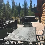 Miles Behind Log Cabin